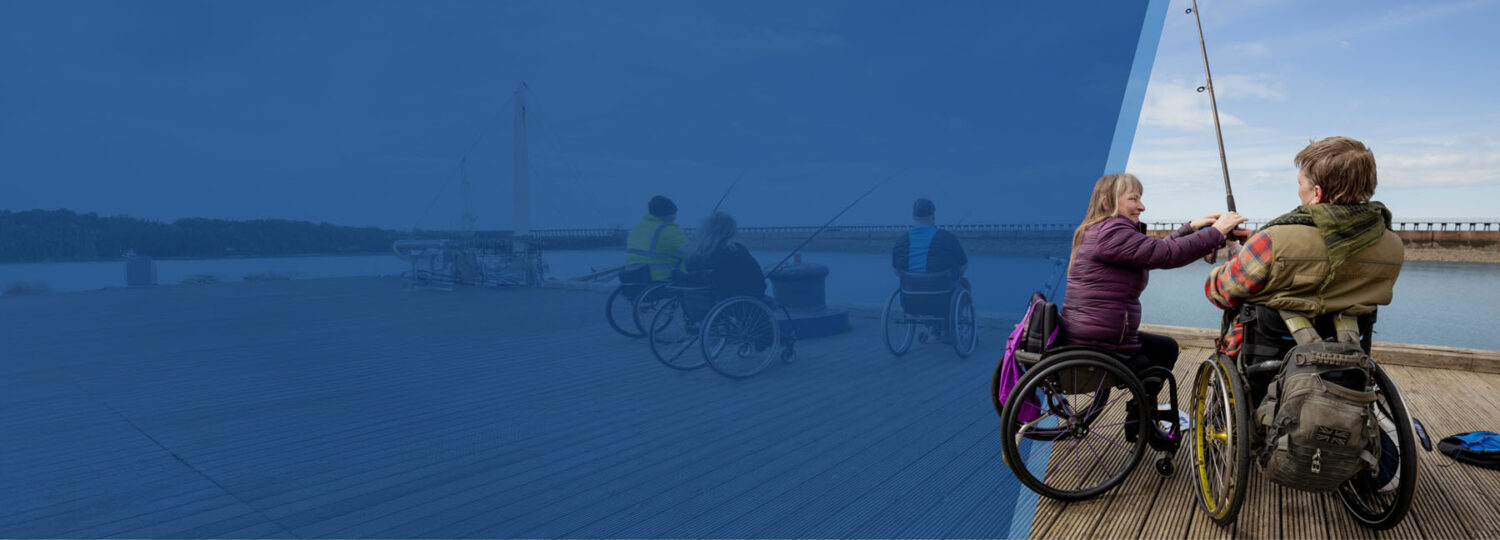  
			 Two people in wheelchairs fish from a wooden pier by the water, with one helping the other. The background shows more people in wheelchairs fishing, partially faded under a blue overlay.
		  		 