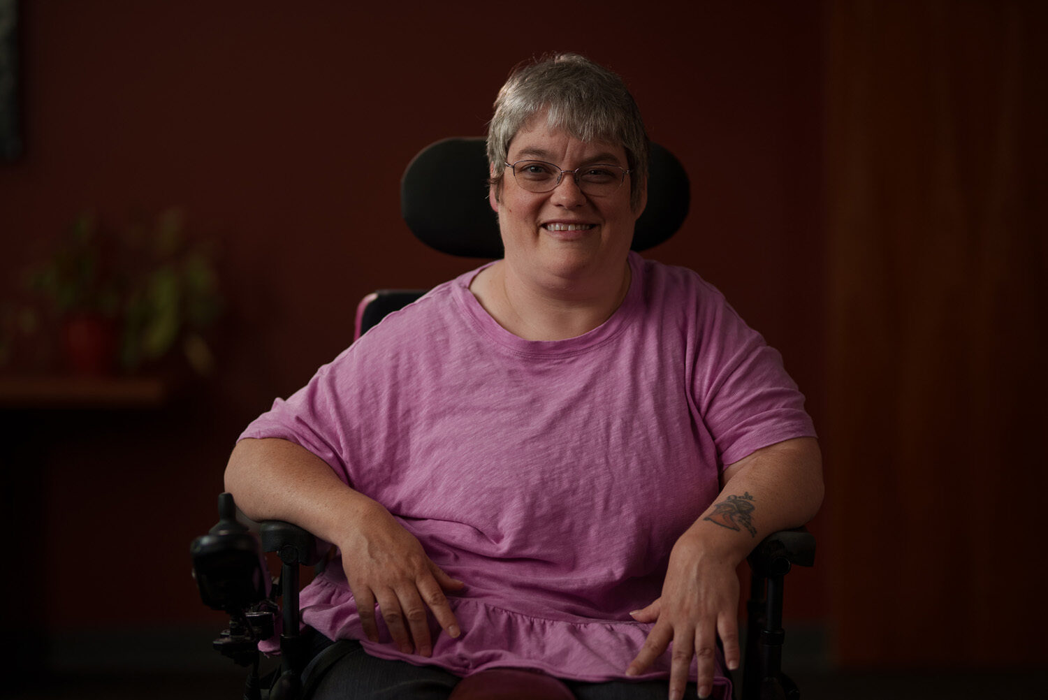 A woman in a wheelchair smiling. profile picture